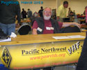 PNWVHFS at the Puyallup Ham Fair with Jim K7ND receiving Conference registrations.